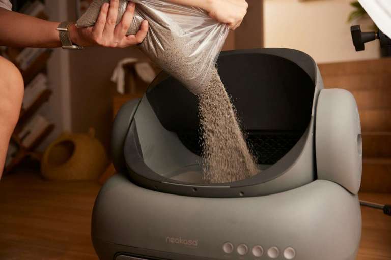 A woman in a silver dress is washing her feet