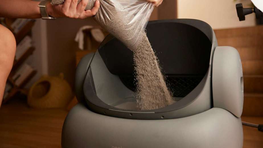 A woman in a silver dress is washing her feet